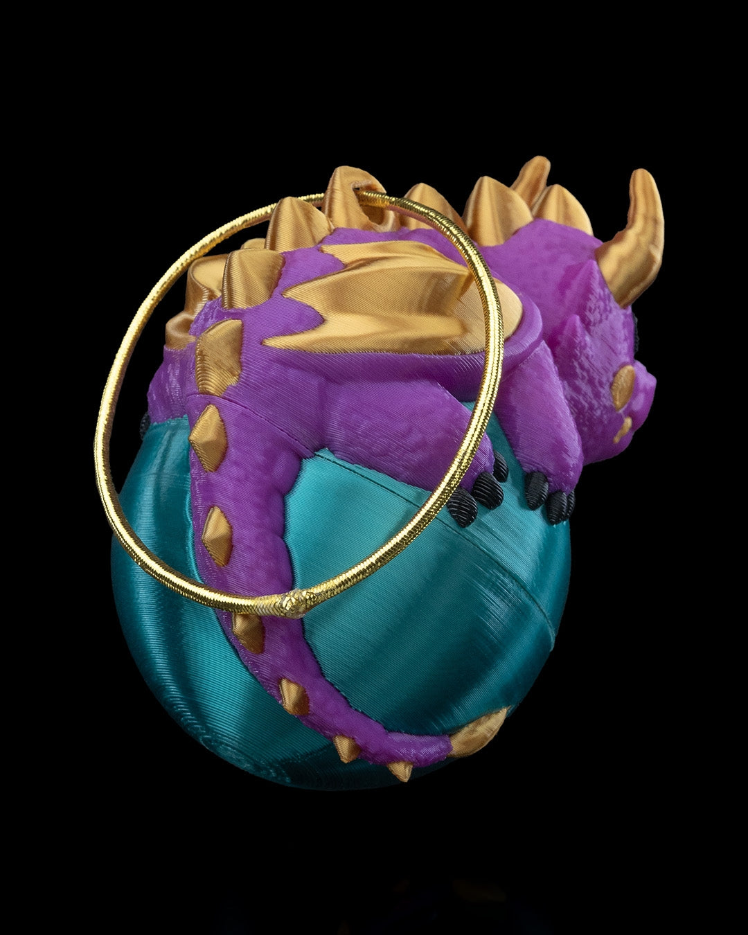 Dragonament, a dragon sleeping on an ornament