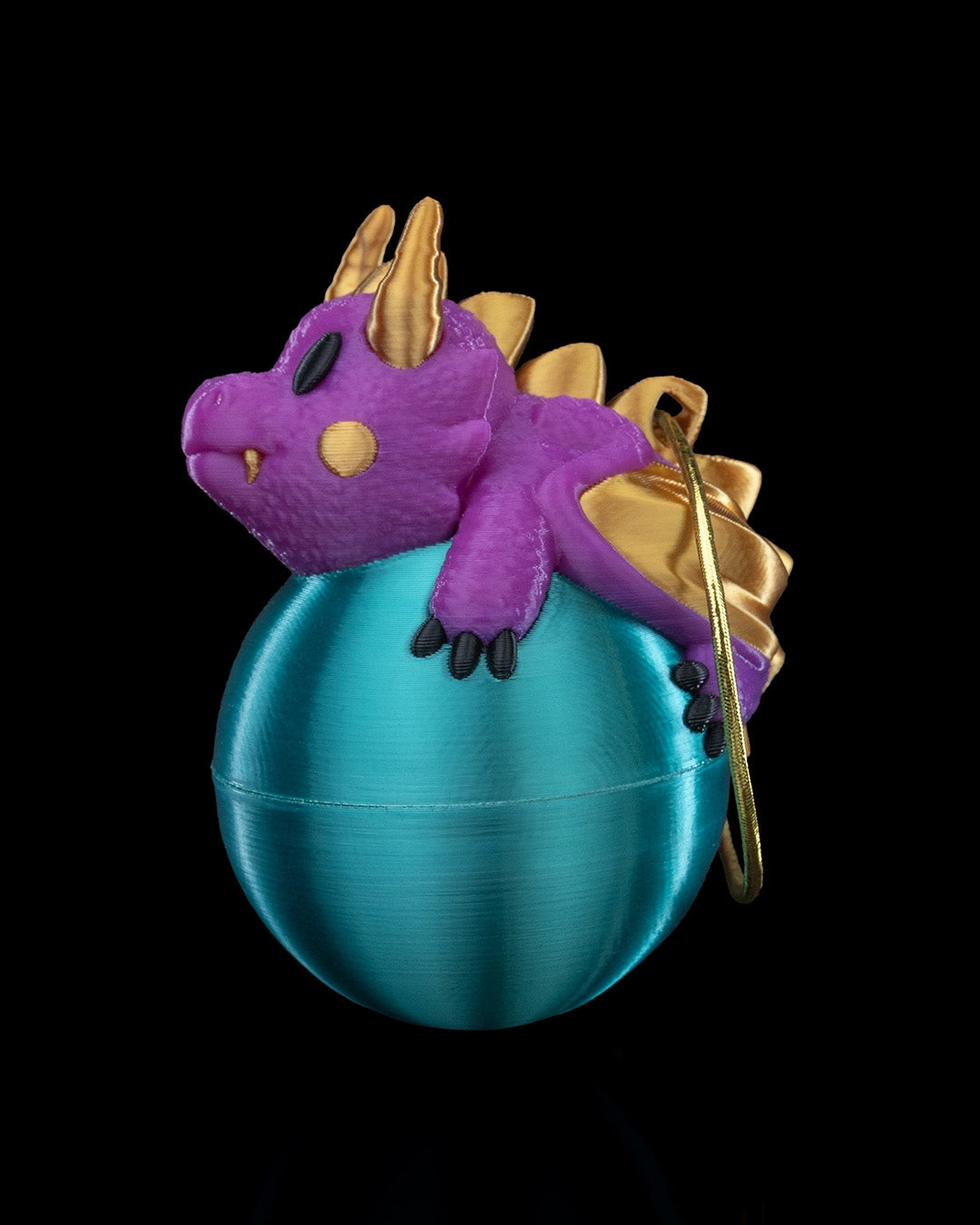 Dragonament, a dragon sleeping on an ornament